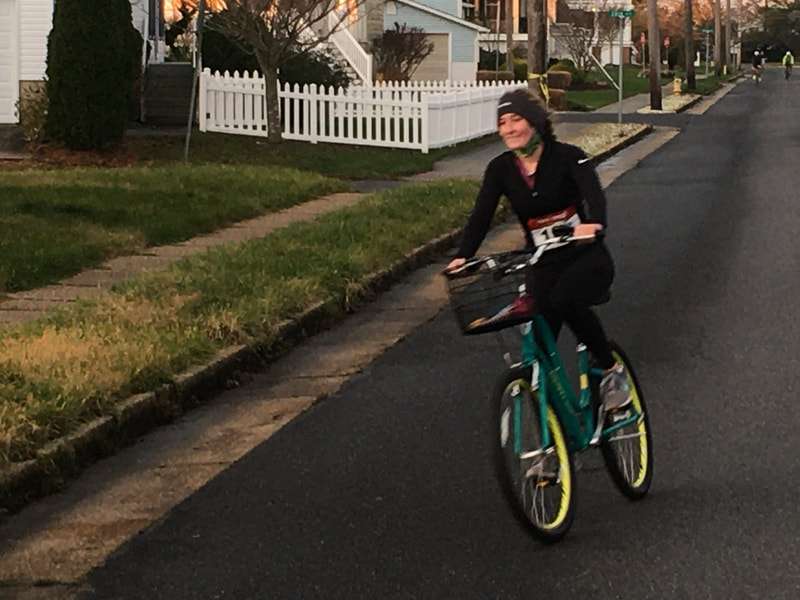 A young female biking in the Brigantine, New Jersey Reverse Super Sprint Triathlon. 